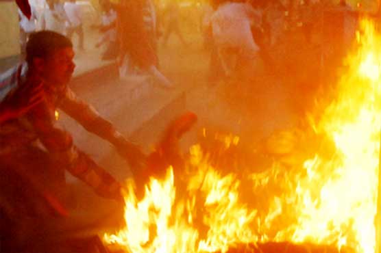 Horror Indian TV debate sees burning man embrace politician 