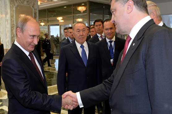 Ukraine and Russian leaders shake hands ahead of peace talks