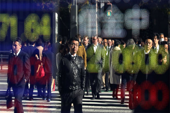 Wall Street, strong dollar push Asian stocks up