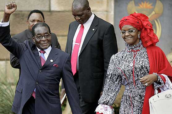 Zimbabwe's ruling party puts Mugabe and wife in top posts