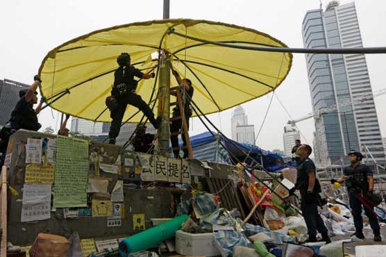 Hong Kong police arrest 209 protesters, demolish main camp