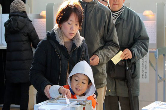 Japan heads to polls with Abe on course to retain power