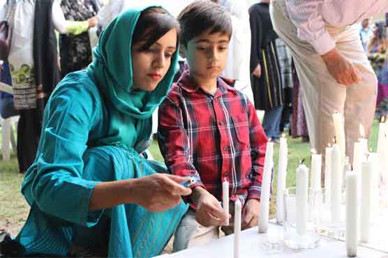Pakistanis pray, resolve to fight terror at stricken school