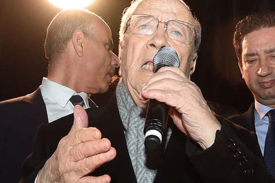 Newly elected leader says Tunisia has 'turned page'