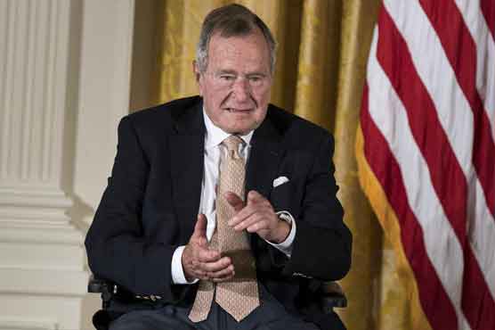 Ex-president Bush spends another night in Texas hospital 
