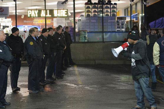 Arrests in protest over police shooting of black teen