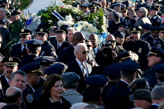 NYC officer mourned at funeral as tensions linger