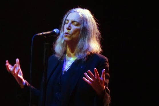 Patti Smith, busy at 68, awakens R.E.M. frontman 