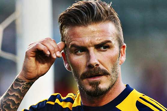 Beckham's football antics lift spirits of Philippines typhoon survivors