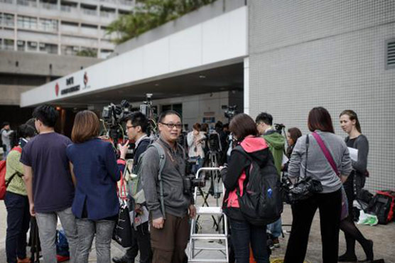Hong Kong journalists vow not to be intimidated after attack