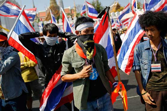 Protestors march in Bangkok despite deadly blast