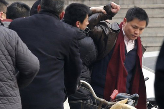 Two China anti-graft activists put on trial