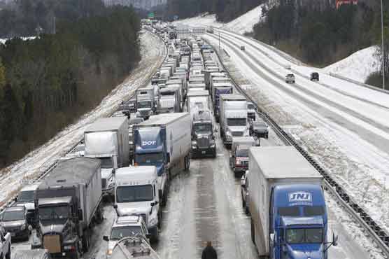 Freak snowstorm, cold snap paralyzes US South