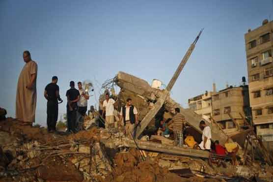 Israel air strikes kill 14 in Gaza on third day of campaign