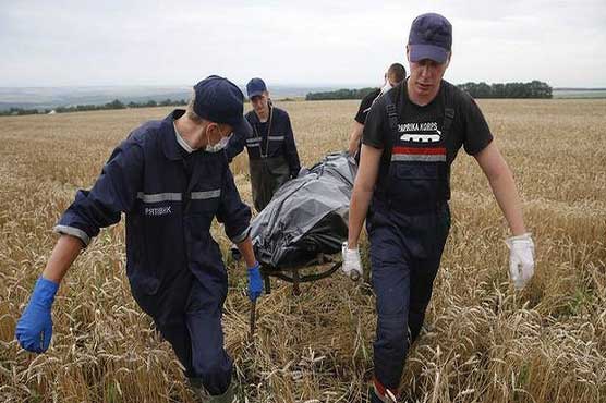 Bodies moved from MH17 site as world demands probe