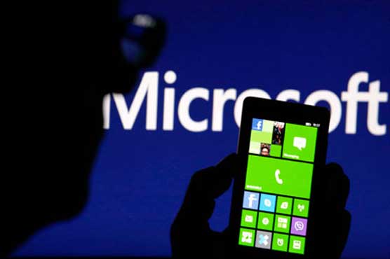 Microsoft profit hurt by Nokia, but revenues jump