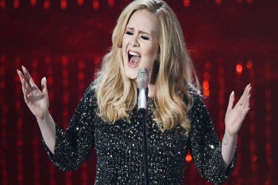 British singer Adele wins damages over photos of son
