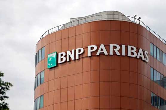 Holland defends BNP Paribas bank before Obama dinner