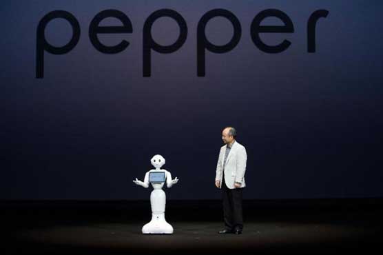 Chatty Japan robot makes friends on first day at work