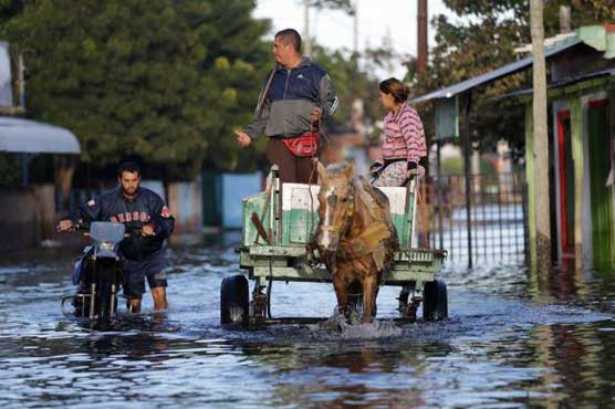 Flooding in Paraguay sends thousands fleeing to shelters