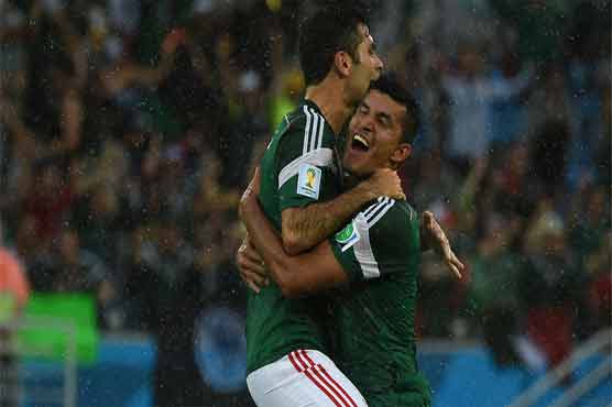 Football: Mexico down Cameroon 1-0 as officials flop again