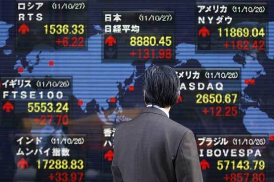 Asia shares mixed as traders watch Iraq, Fed meeting