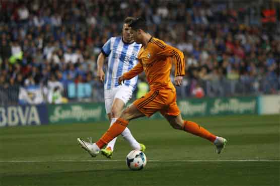 Football: Ronaldo winner keeps Madrid on track in Malaga
