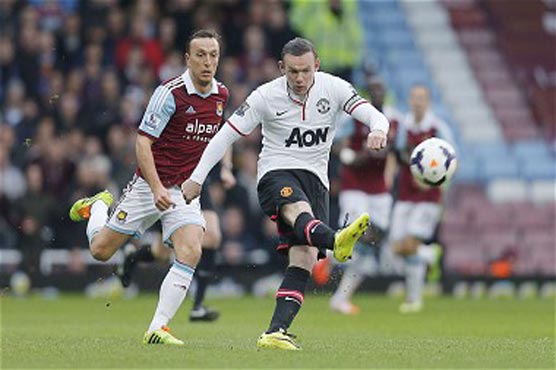 Football: Rooney wonder lob keeps United on high