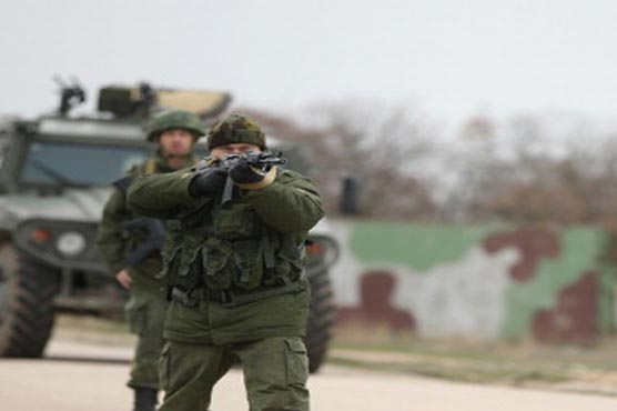 Russian troops storm Ukrainian bases in Crimea