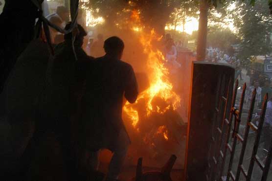 Man with flames hugs local politician on Indian TV debate