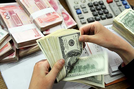 Dollar holds steady in Asia