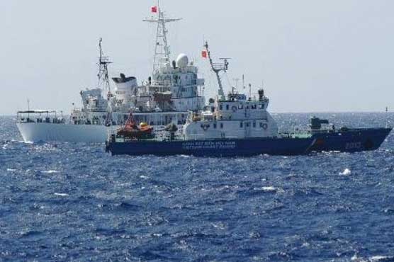 Vietnam accuses Chinese ships of gun threats 