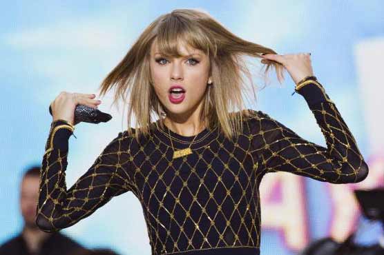 Taylor Swift shakes off competition to hold Billboard top spot