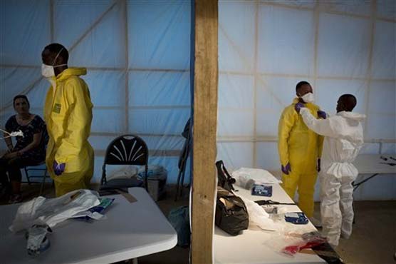Chinese medics beef up Ebola fight; US doctor remains ill