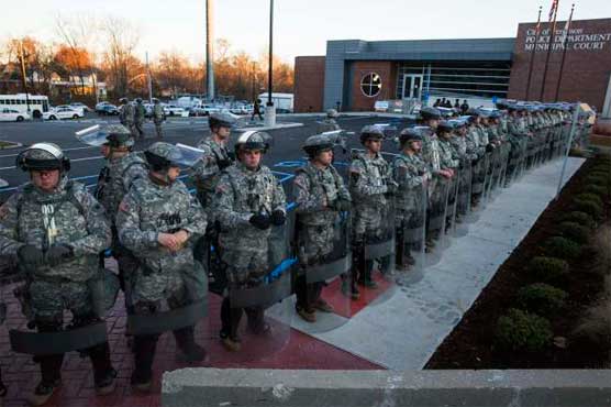 Troop force tripled in Ferguson as Obama condemns violence
