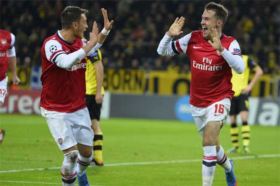 Football: Arsenal down Dortmund to make last 16