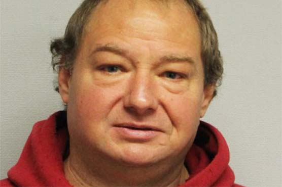 Man held after choking neighbor's loud dog