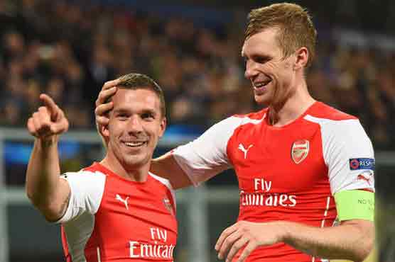 Football: Podolski the hero as late goals rescue Arsenal