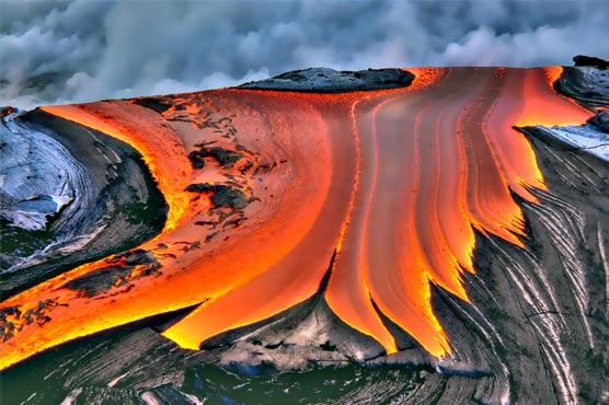 Hawaii lava flow is slow, gentle yet unrelenting