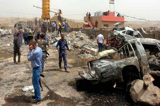 Blasts kill 19 as Kerry visits Iraq capital