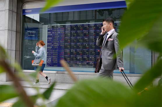 Asian shares mostly lower, China inflation eases 