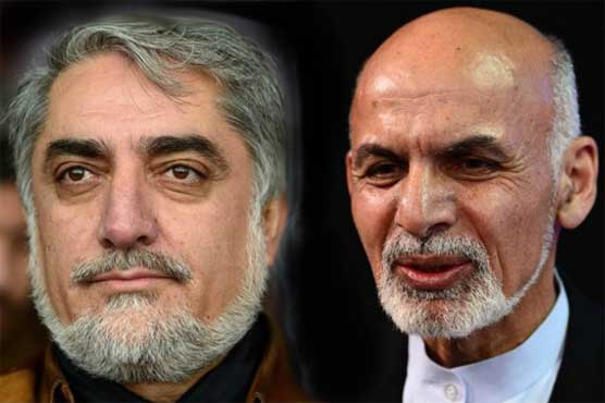 Afghan's rival presidential candidates sign power-sharing agreement