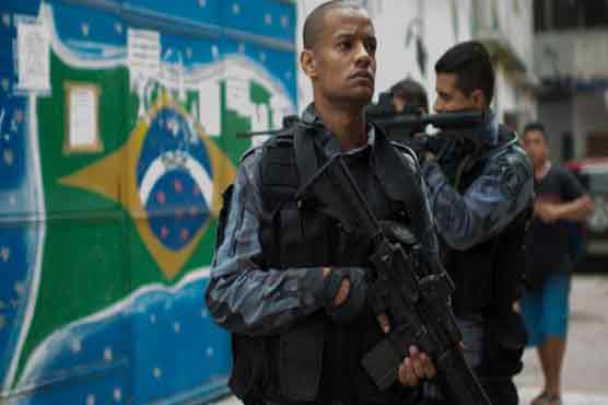 Police take over from military at Rio slum near airport