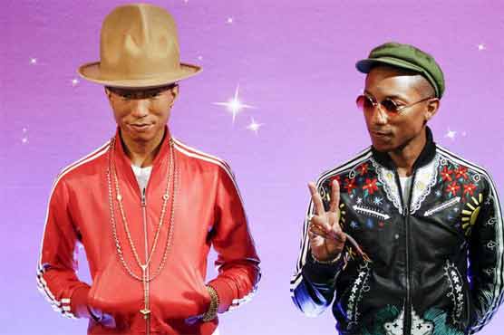 Singer Pharrell Williams meets his wax double in New York