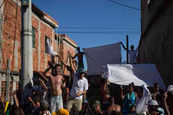 Rio police fire tear gas at protest over boy's death