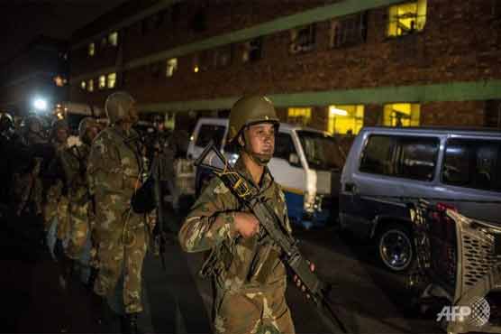 11 arrested in S.African police and army raid