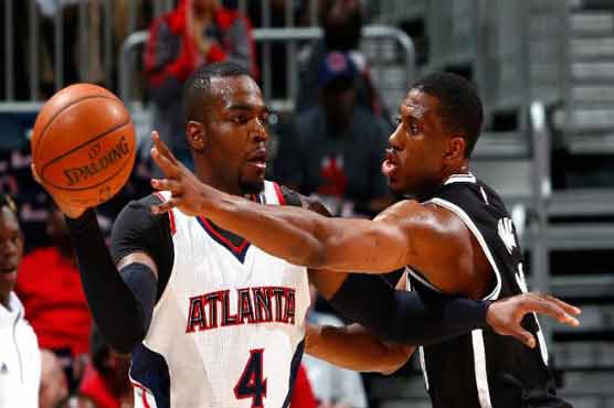Hawks announce sale, then hold off Nets for playoff win