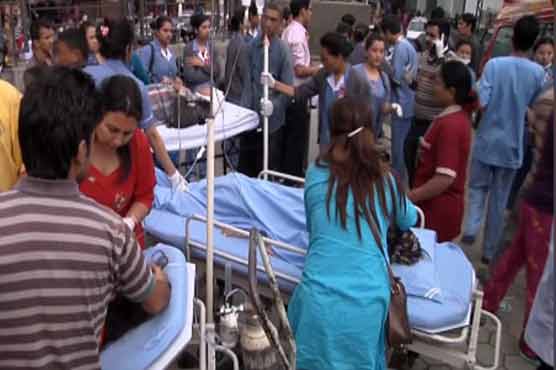Scared to stay inside, Nepal quake victims treated in car park
