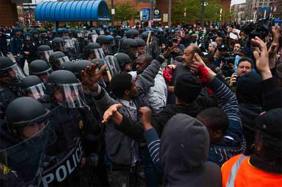 Baltimore police arrest 34 after violent protests
