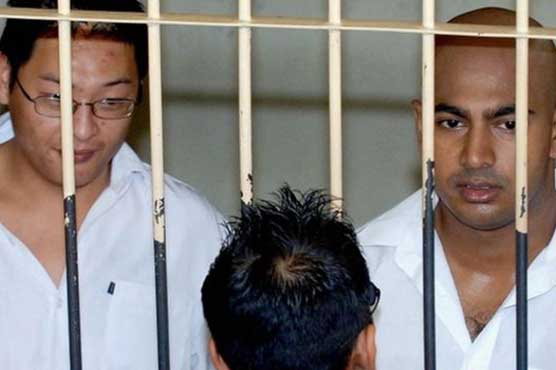 Australia urges Indonesia to halt executions of drug smugglers until corruption probe